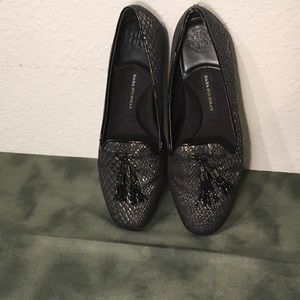 Black and silver slide on loafers with tassel